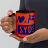 white-ceramic-mug-with-color-inside-orange-15-oz-left-6a06ea0f681df.jpg Sydslesvig in vier Symbolen – Keramiktasse